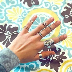 Set of 9 silver colored rings